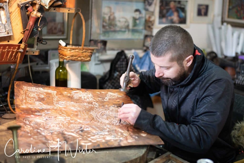 Coppersmith at work in Kujundziluk. This is one of the few coppersmiths that Sheva Walking Tours visits during tours. 